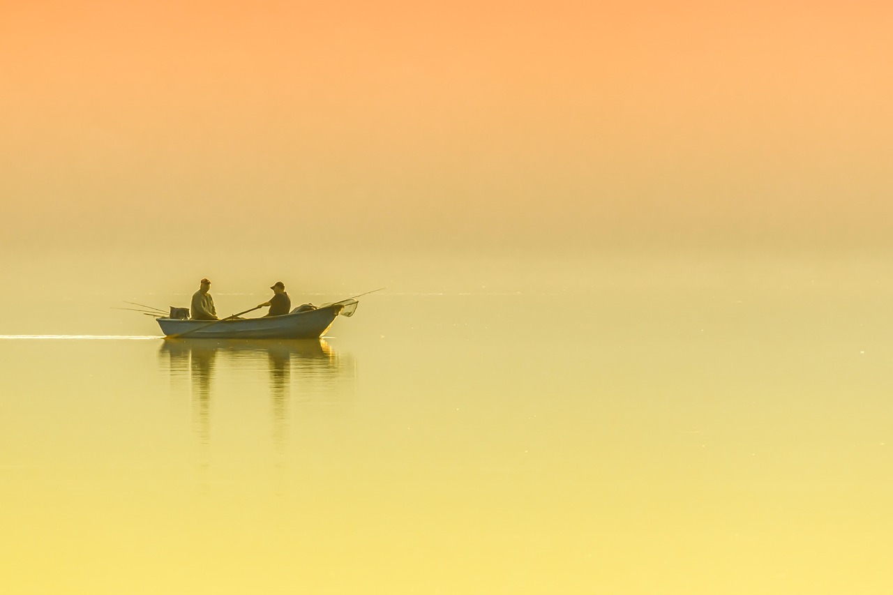 bass fishing sunrise on lake